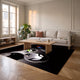 Tapis gaming noir à motif de manette dans un salon