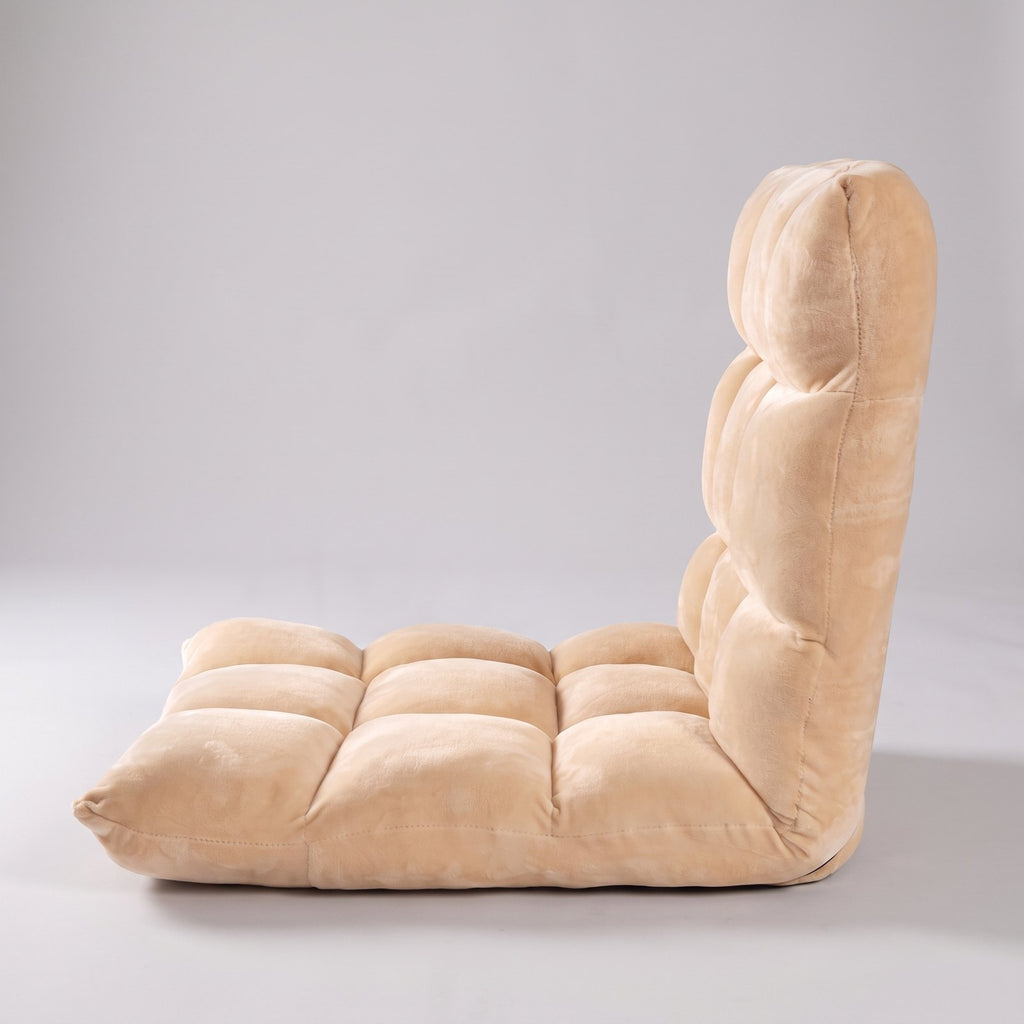 Fauteuil de sol beige vu de profil, dossier relevé