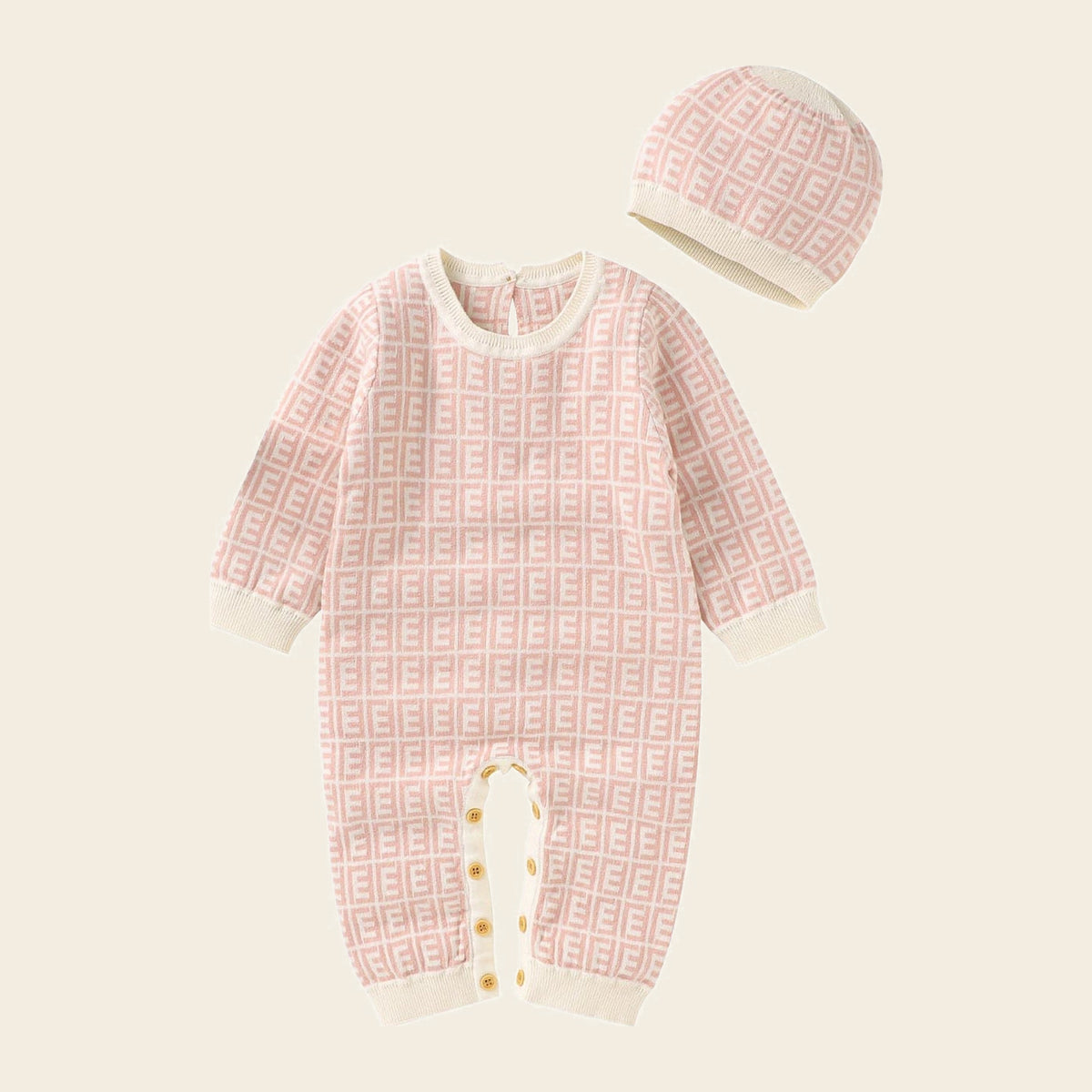 Barboteuse bébé rose à motif géométrique avec son bonnet assorti