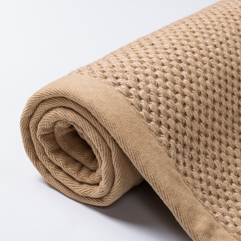 Tapis rectangulaire beige au tissage bouclé avec bordure assortie