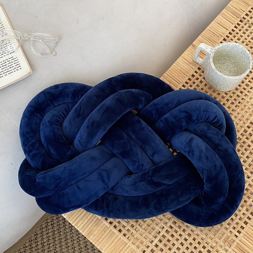Coussin nœud en velours bleu marine