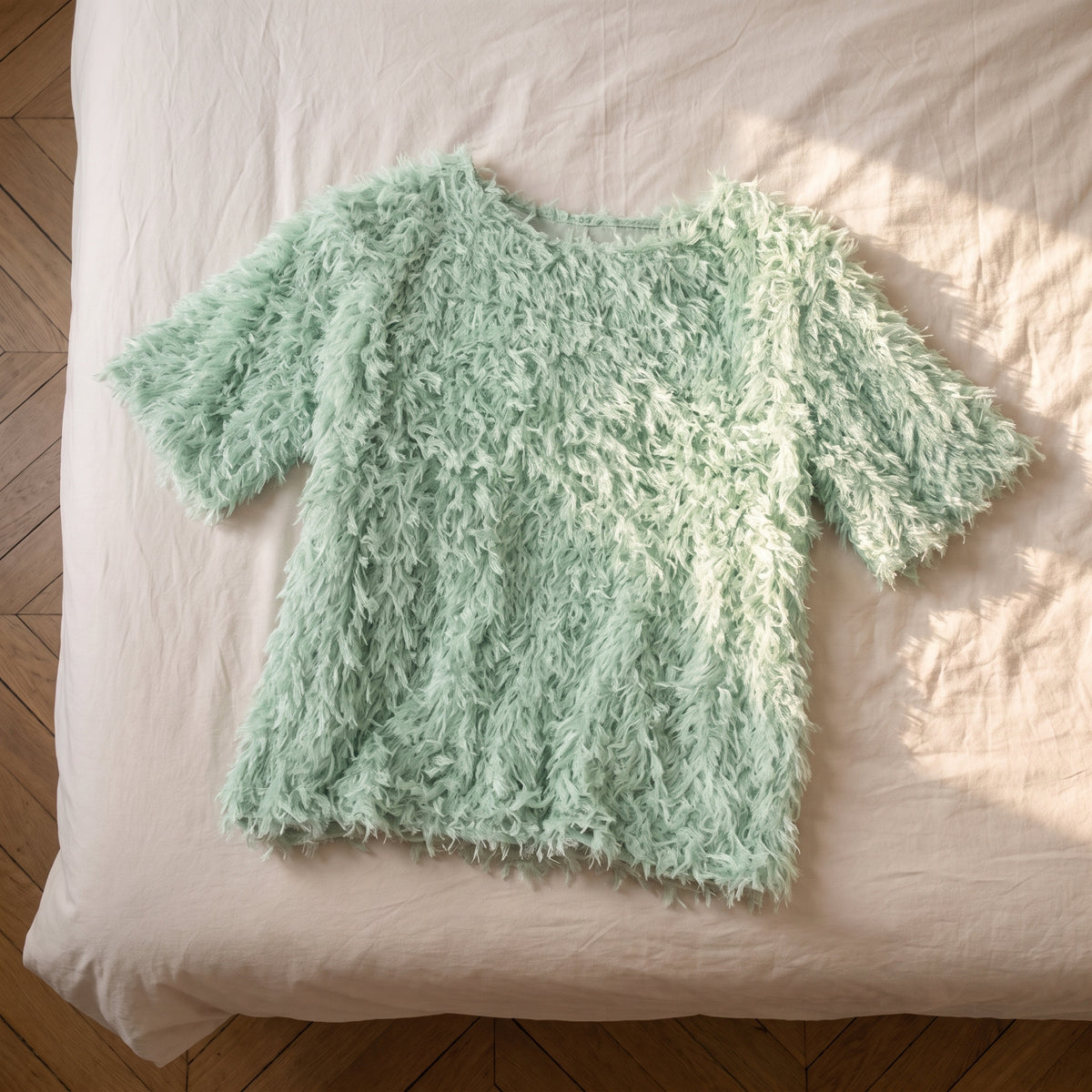 Pull en maille effet plumes, coloris Vert menthe, posé à plat