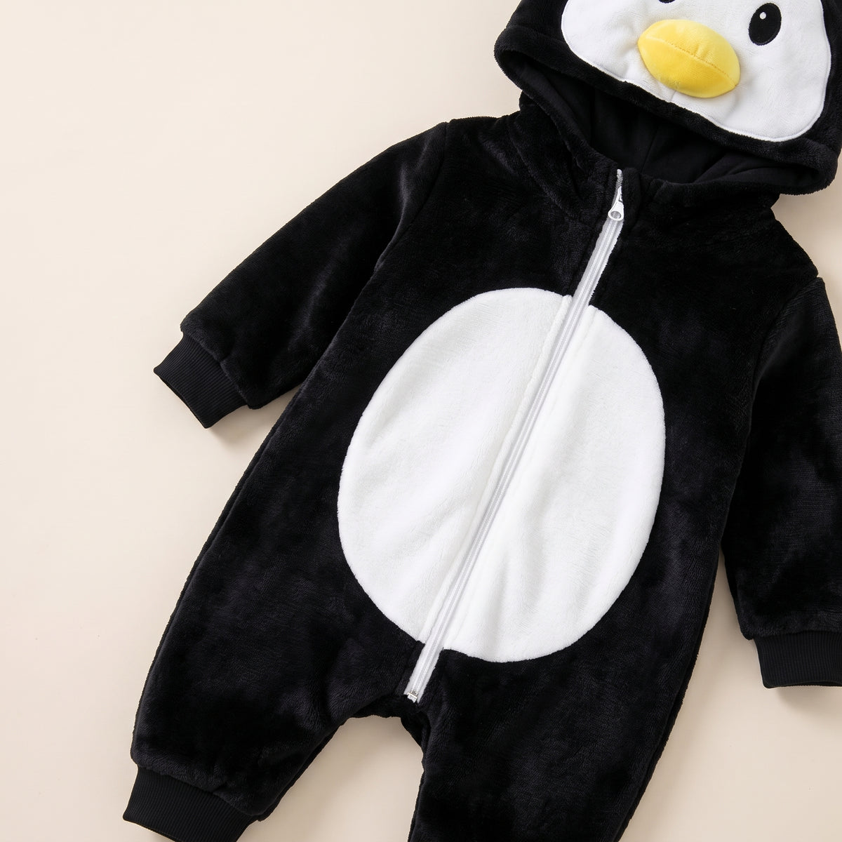 Fermeture à glissière d'une barboteuse déguisement pingouin Image