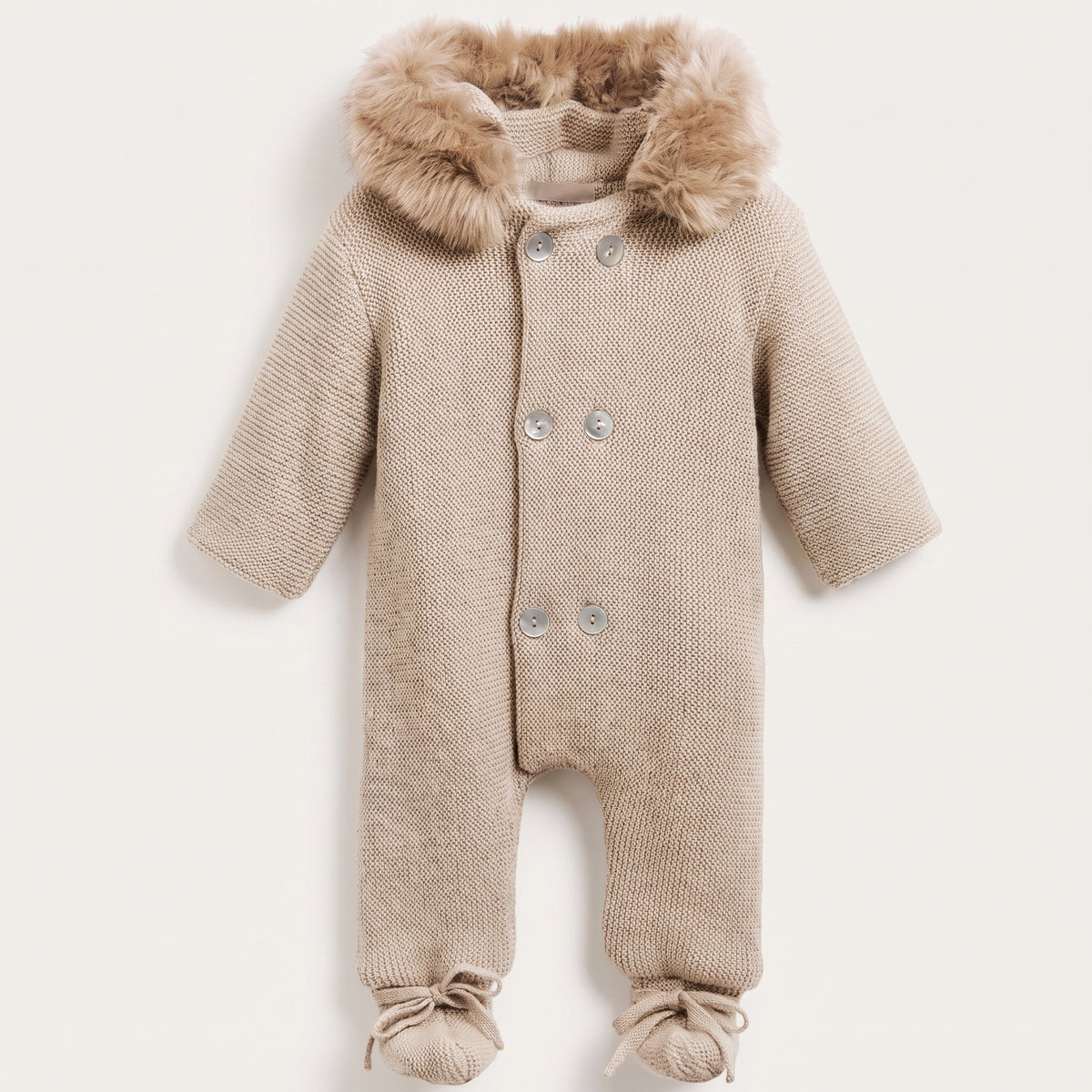 Combinaison beige pour bébé avec fermeture à six boutons
