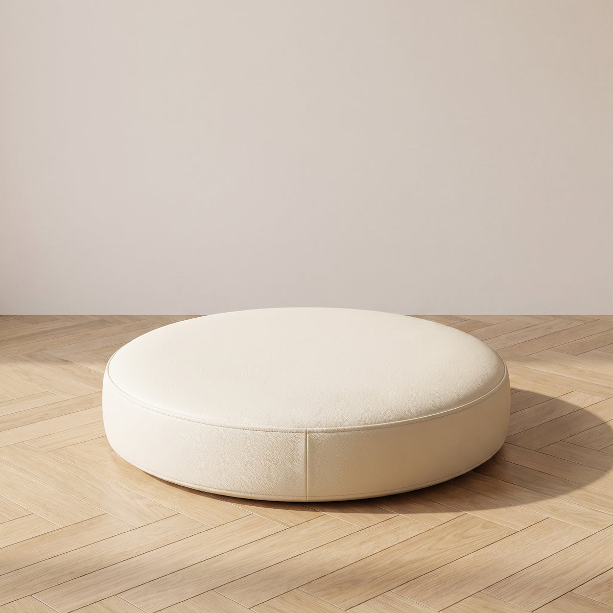 Coussin de sol rond en simili cuir blanc cassé