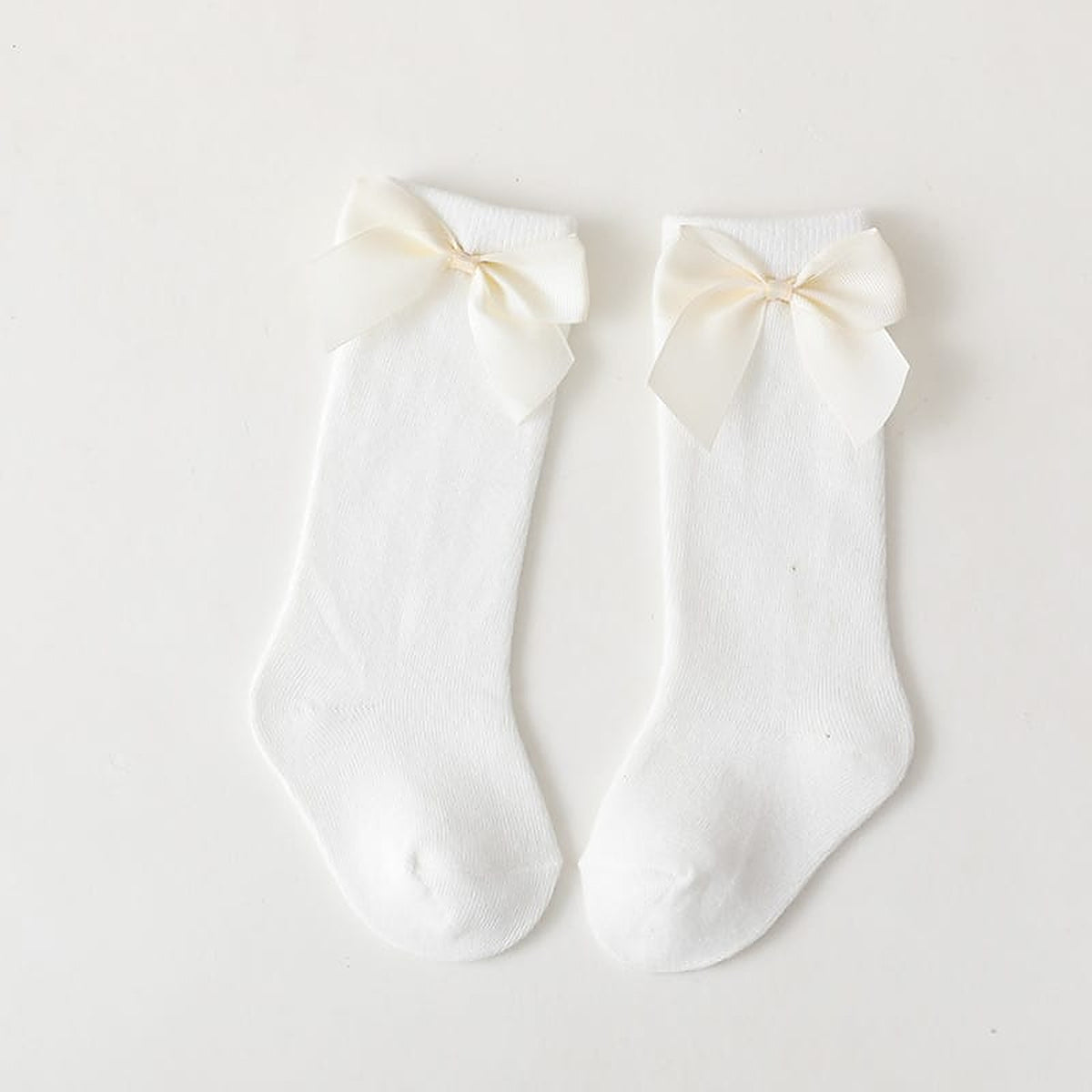 Paire de chaussettes hautes blanches a grand noeud pour enfant