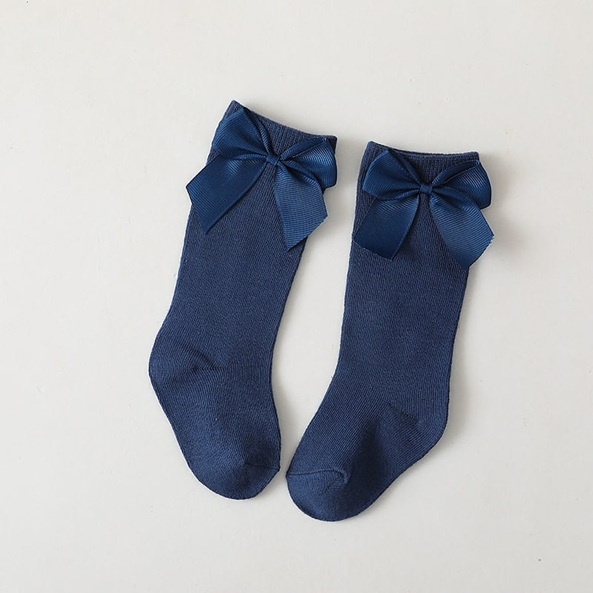 Paire de chaussettes hautes bleu marine a grand noeud pour enfant