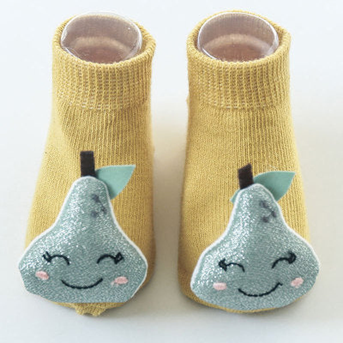 Une paire de chaussettes antidérapantes bébé, motif poire