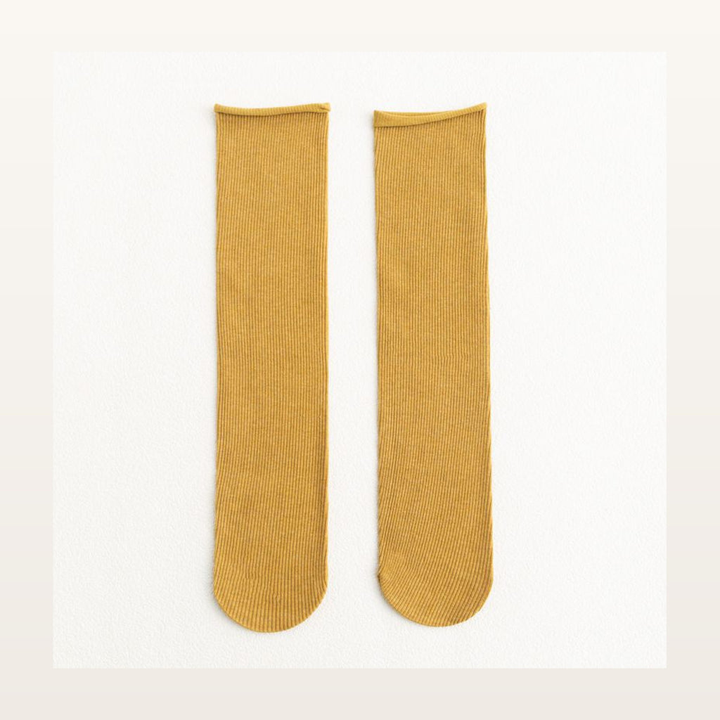 Paire de chaussettes longues unies jaunes à maille côtelée