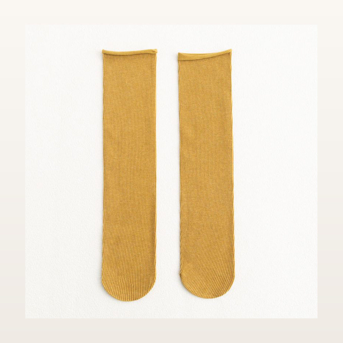Paire de chaussettes longues unies jaunes à maille côtelée