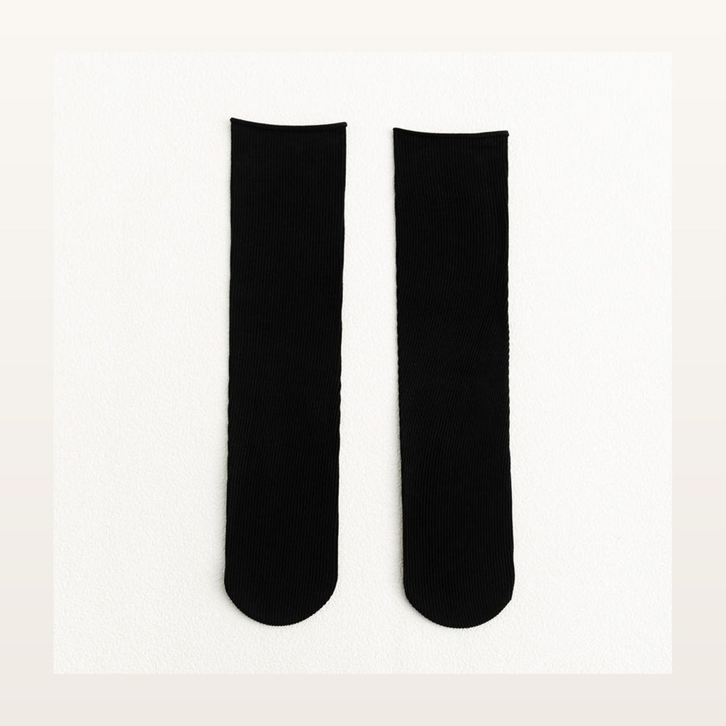 Paire de chaussettes longues unies noires à maille côtelée