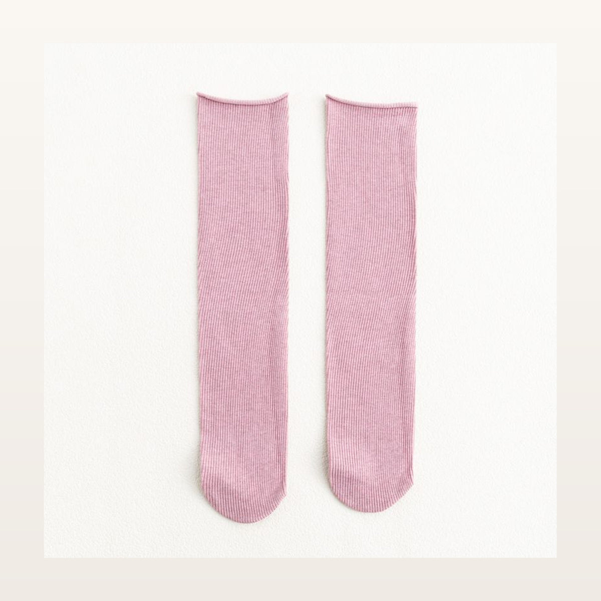 Paire de chaussettes longues unies roses à maille côtelée