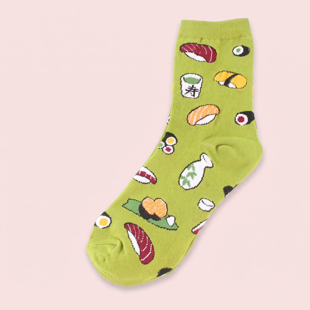 Chaussette sushi verte à plat sur fond rose poudré