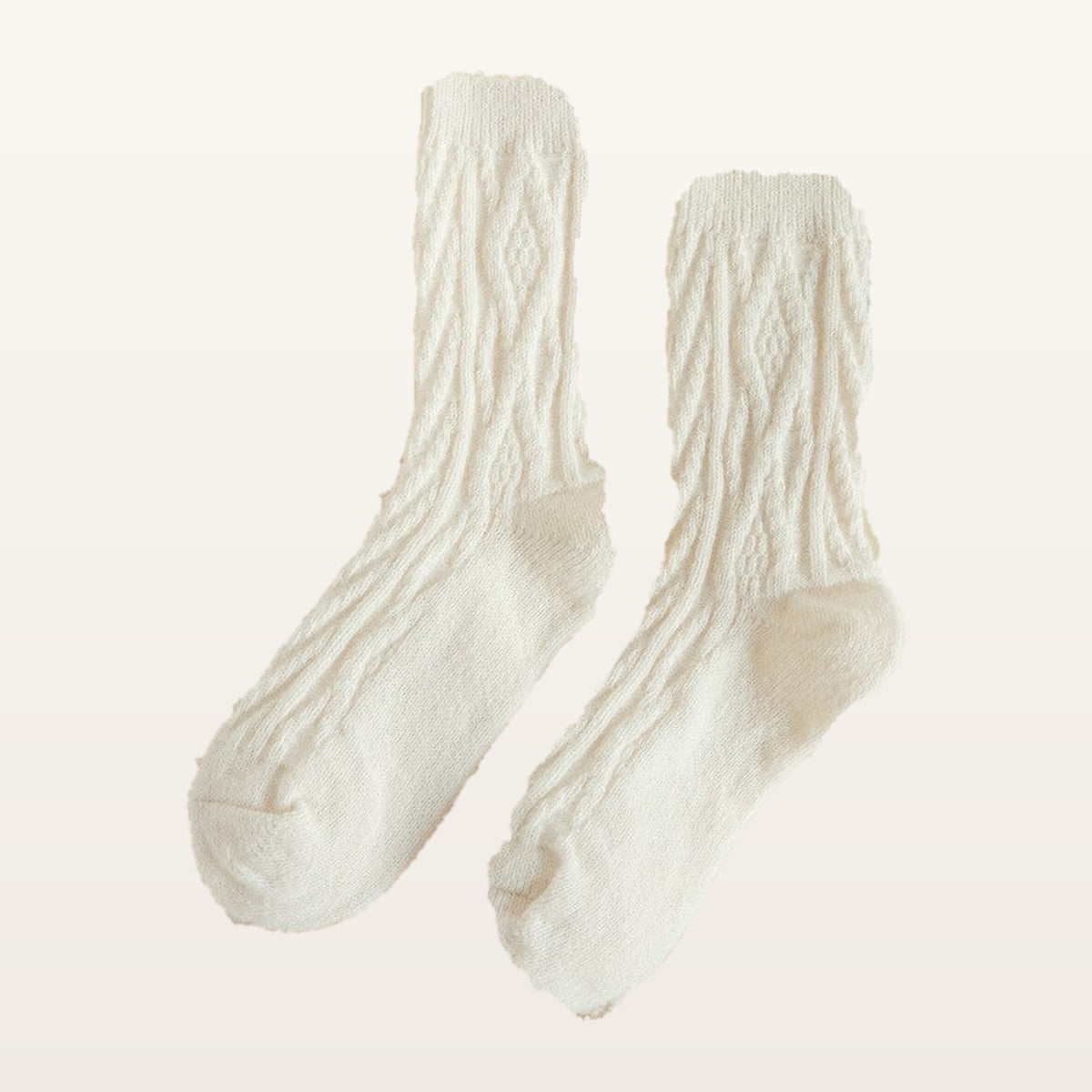 Paire de chaussettes tricotées blanches à petites torsades