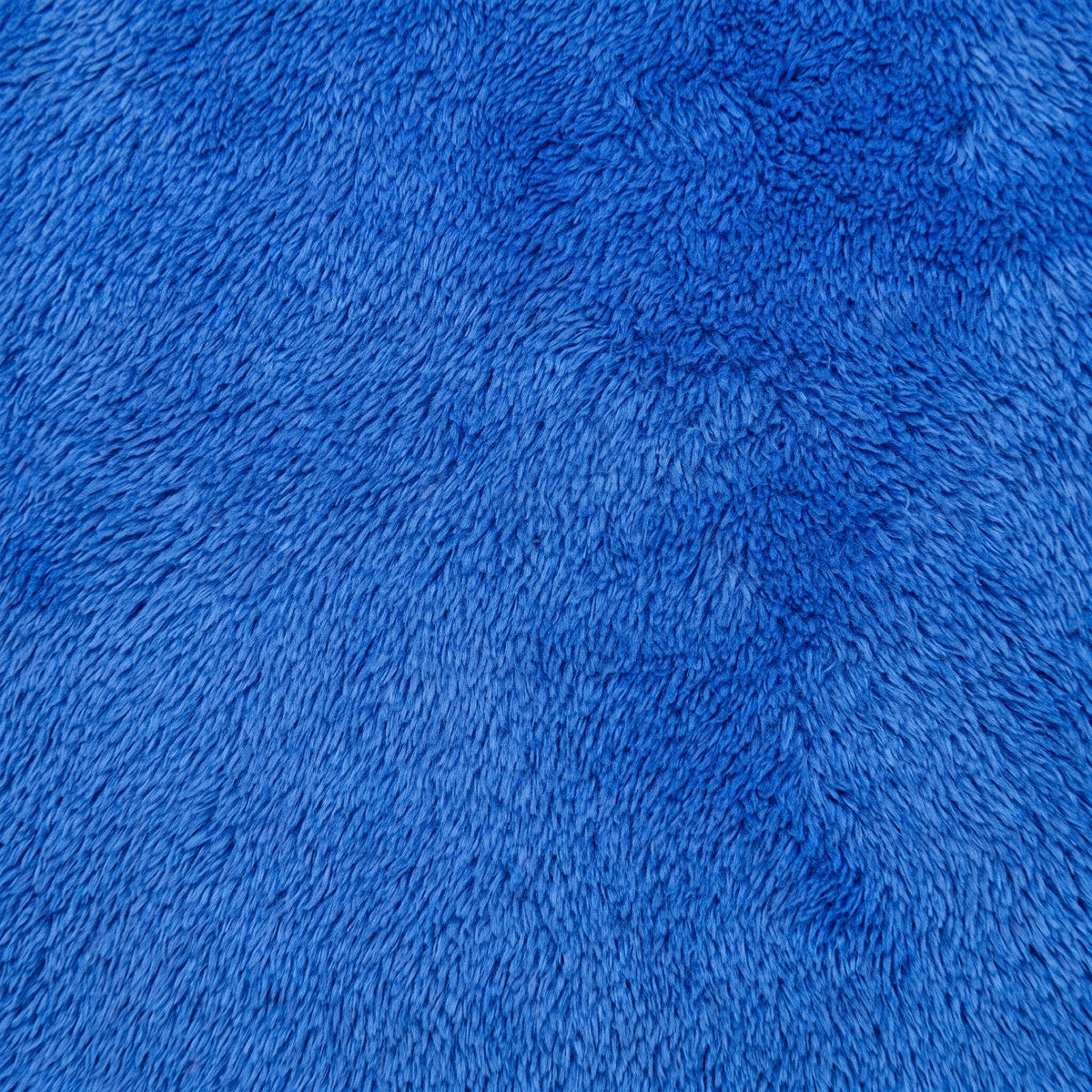 Gros plan sur la maille polaire bleue du plaid à capuche enfant Image