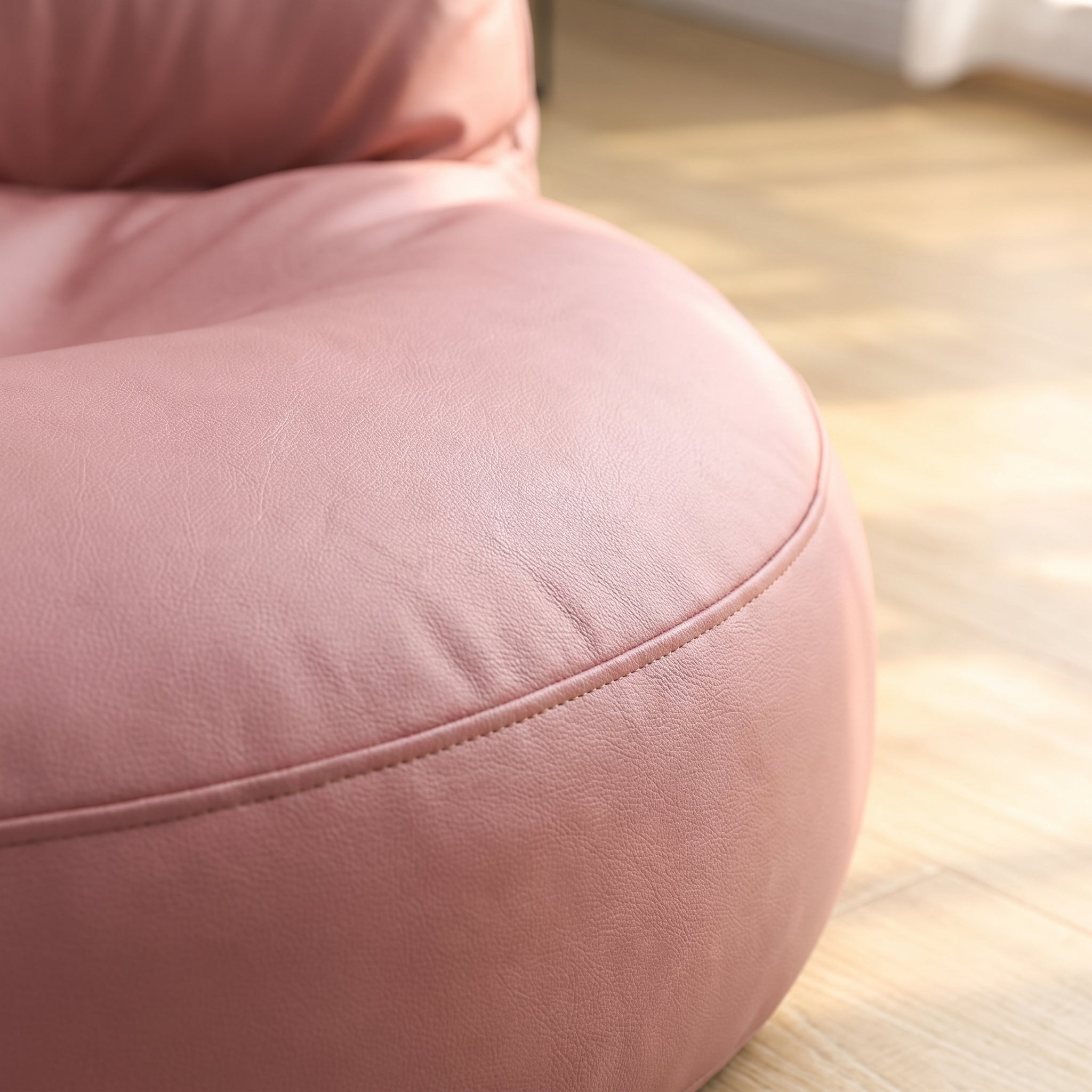 Bord de l'assise du pouf rose et la couture qui en fait le tour Image