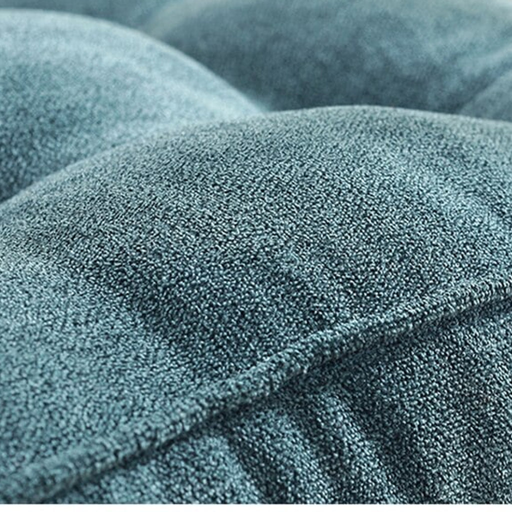 Vue rapprochée de la surface textile du coussin capitonné