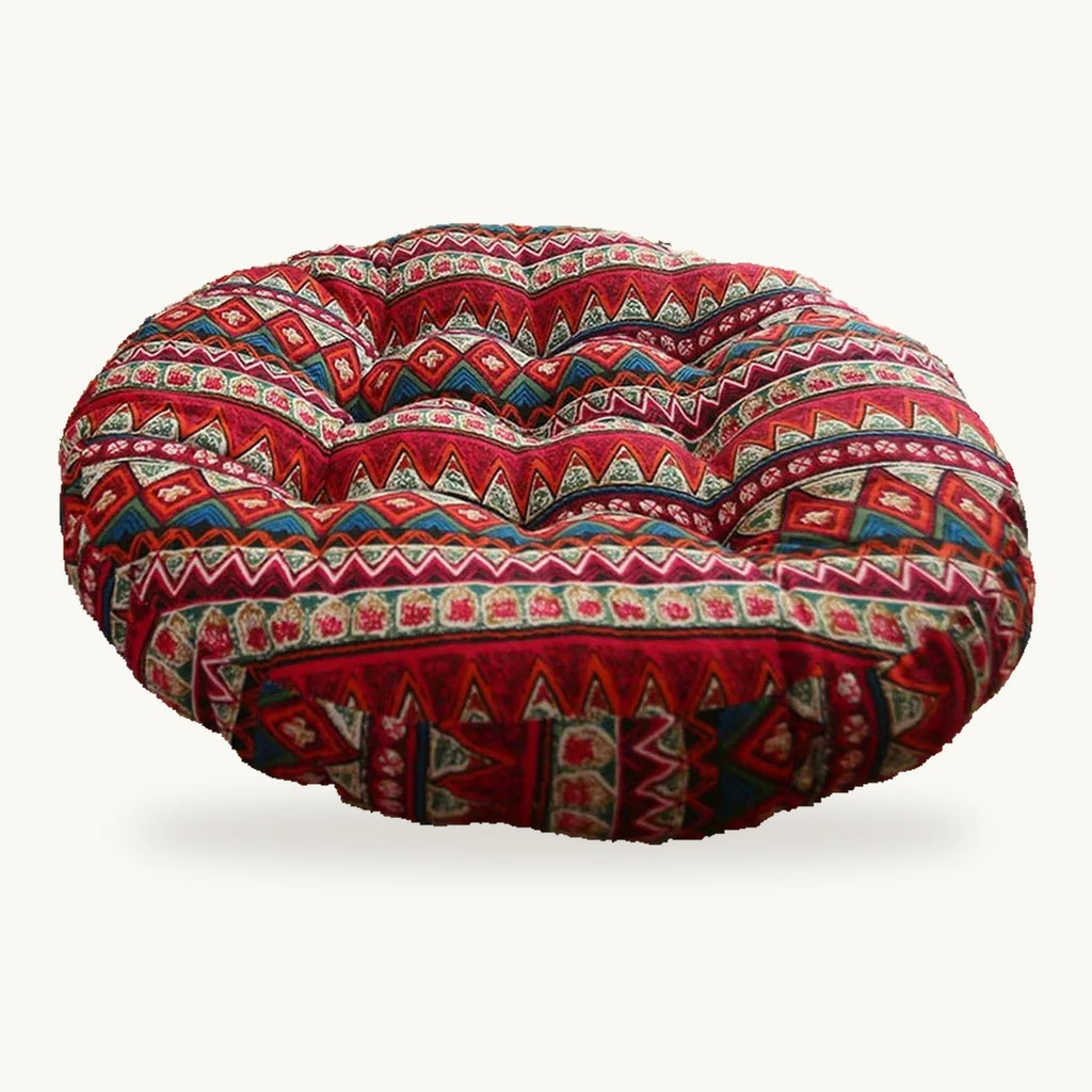 Coussin de sol rond capitonné à motif géométrique rouge sur fond clair