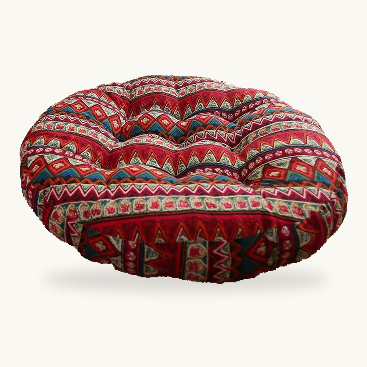 Coussin de sol rond capitonné à motif géométrique rouge sur fond clair