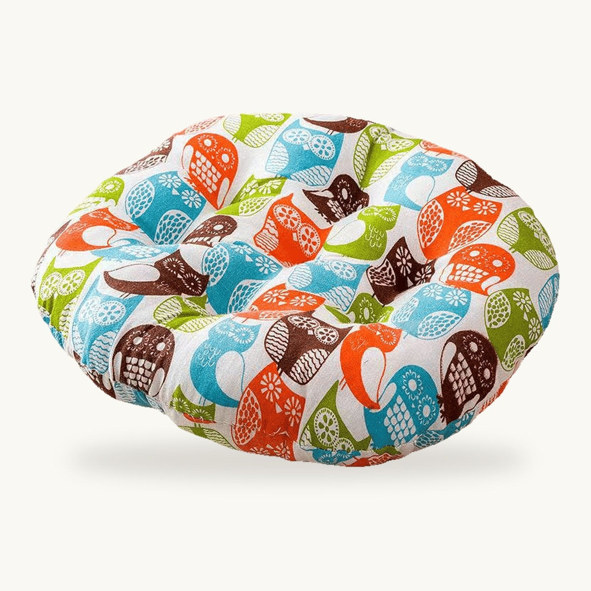 Coussin de sol rond capitonné à motif de chouettes colorées sur fond clair