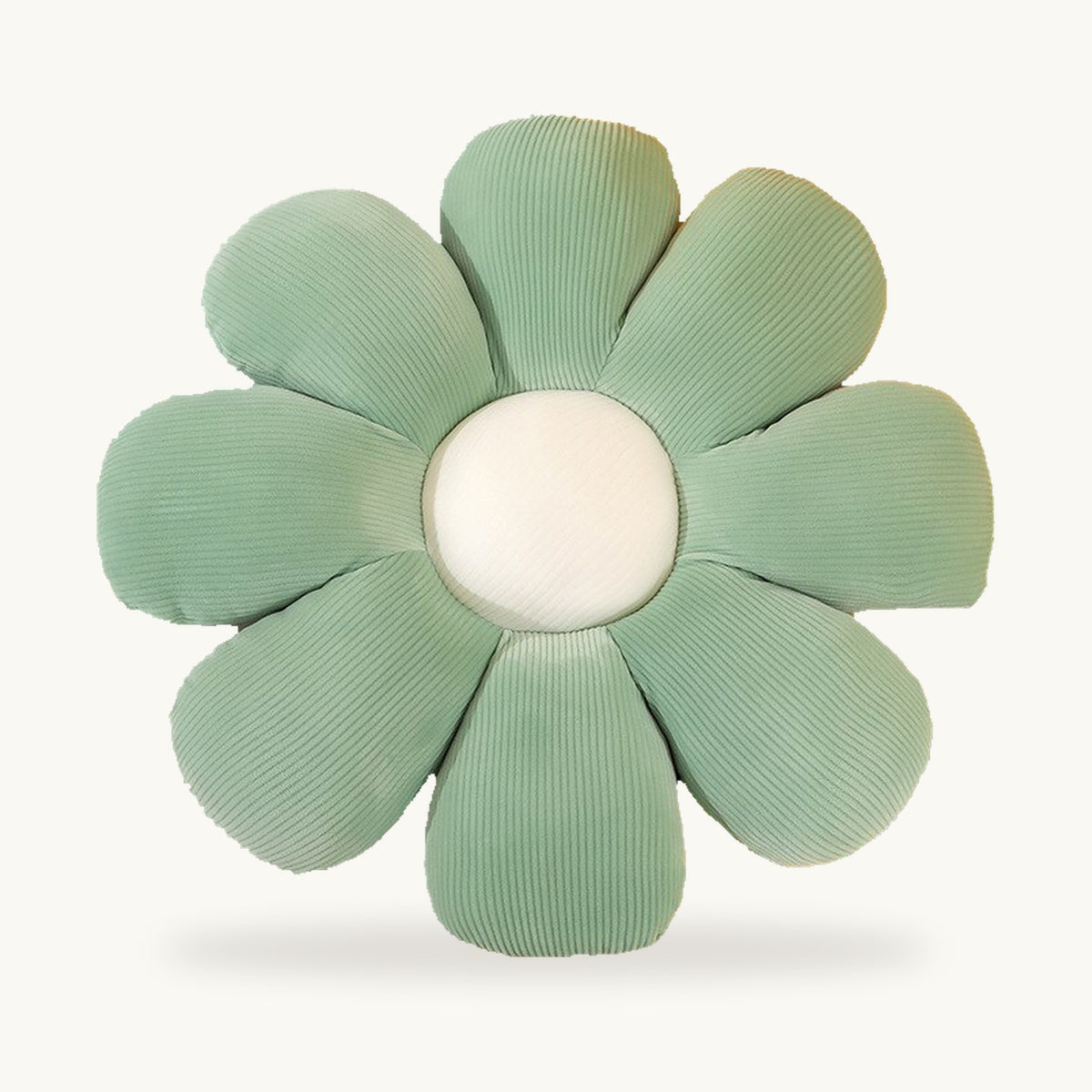 Coussin fleur vert à huit pétales et centre blanc vu de face