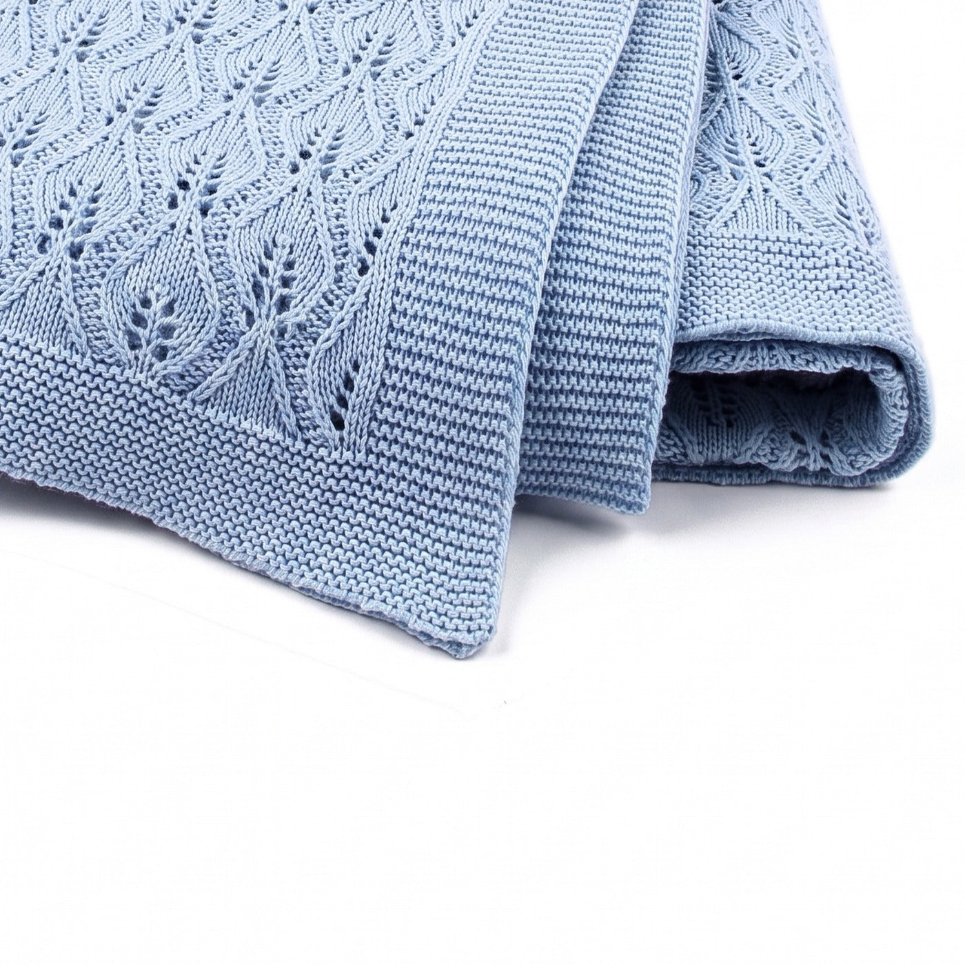 Couverture pour bebe en coton bleu pliee au format carre Image
