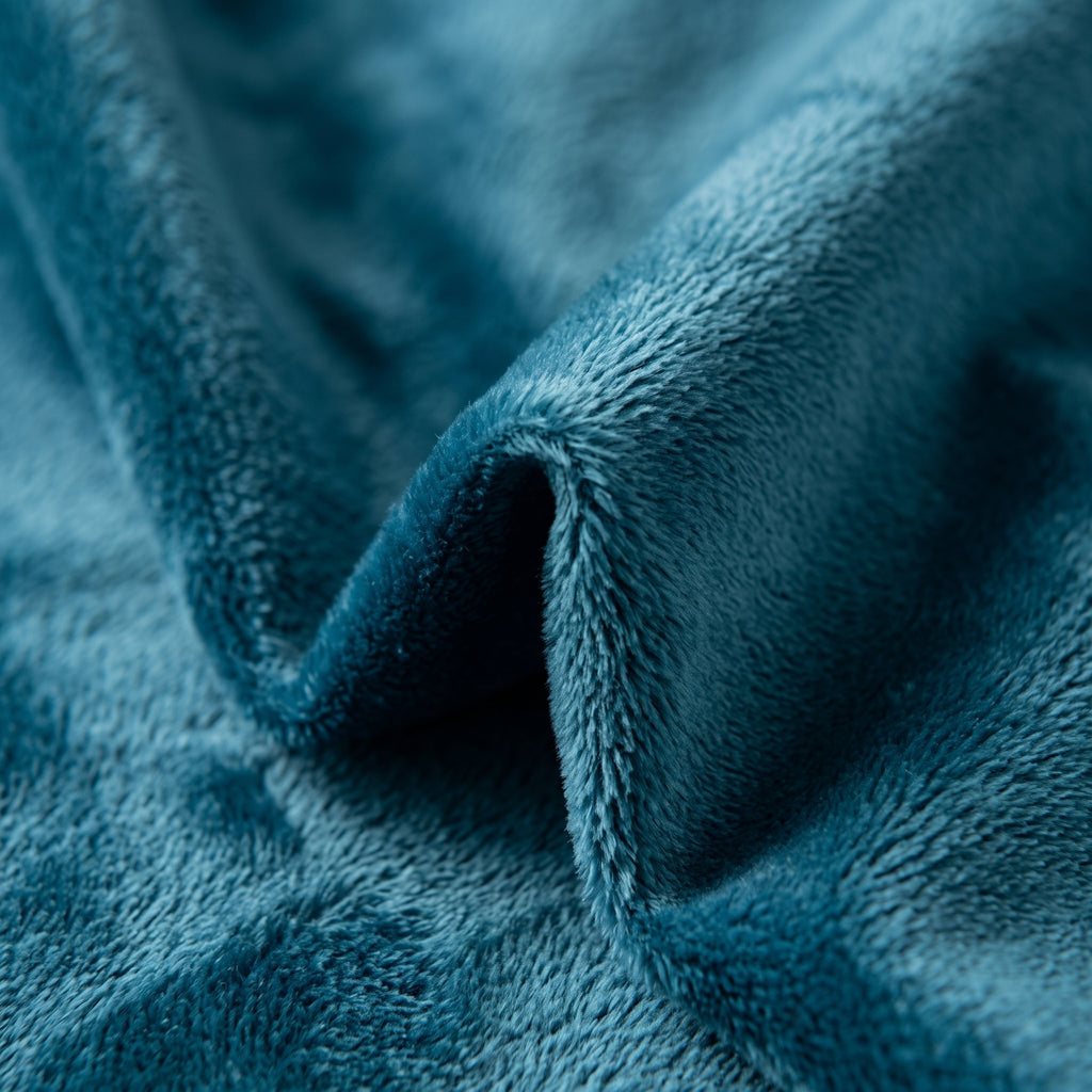 Detail macro de la texture du velours bleu petrole