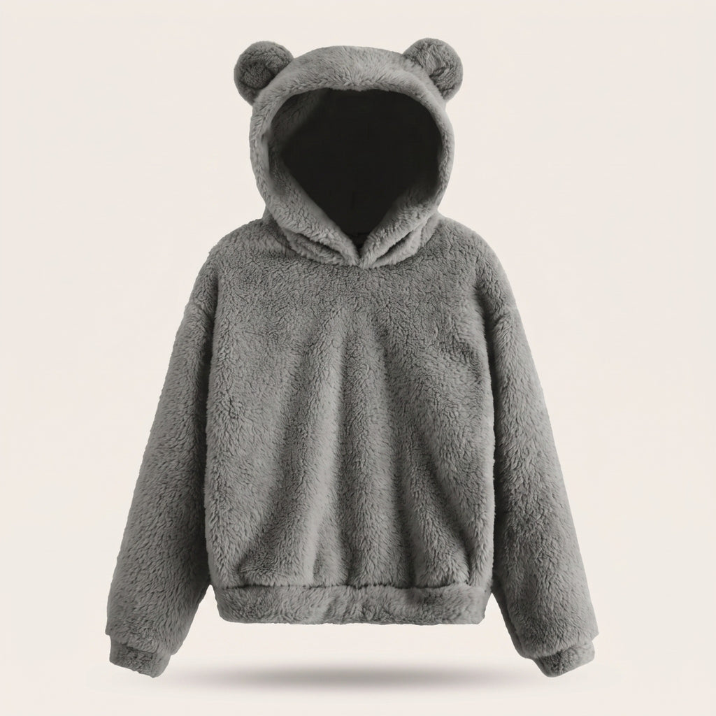 Le sweat ourson gris porte par un mannequin invisible, capuche relevee, manches galbees et bande froncee au bas du vetement
