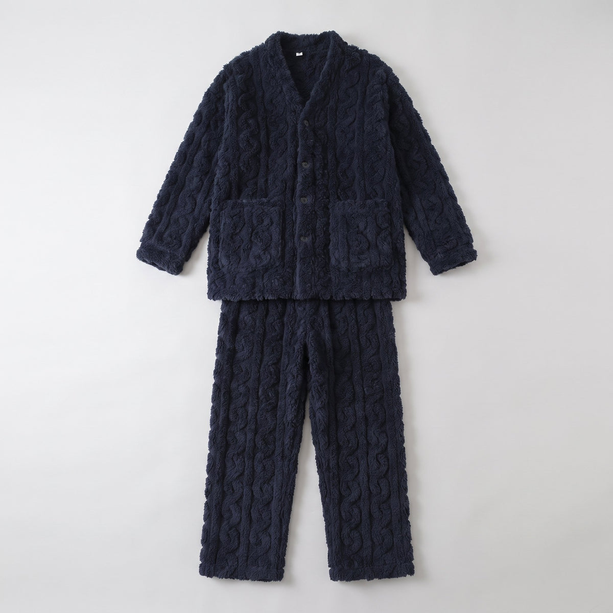 Ensemble de pyjama bleu marine à plat, veste boutonnée et pantalon