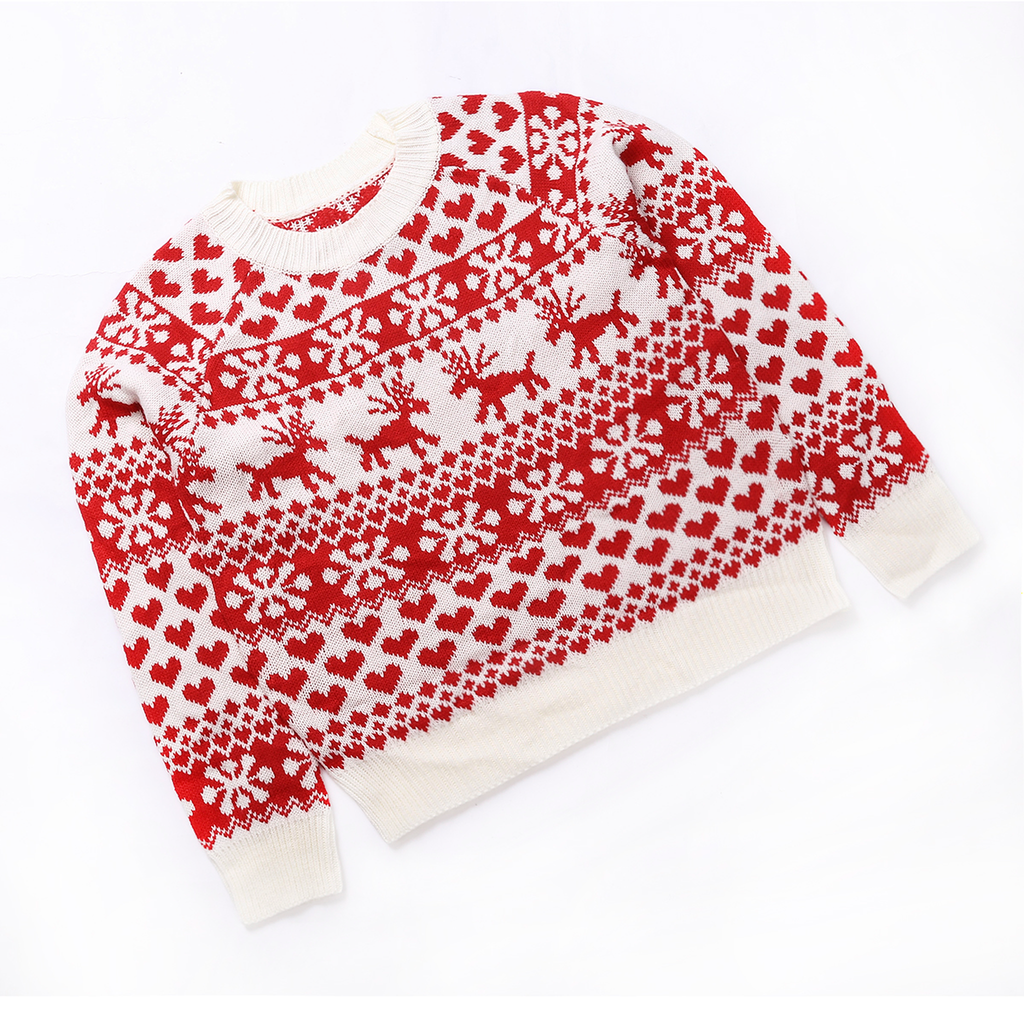 Pull de Noël femme blanc à motifs rouges vu en angle