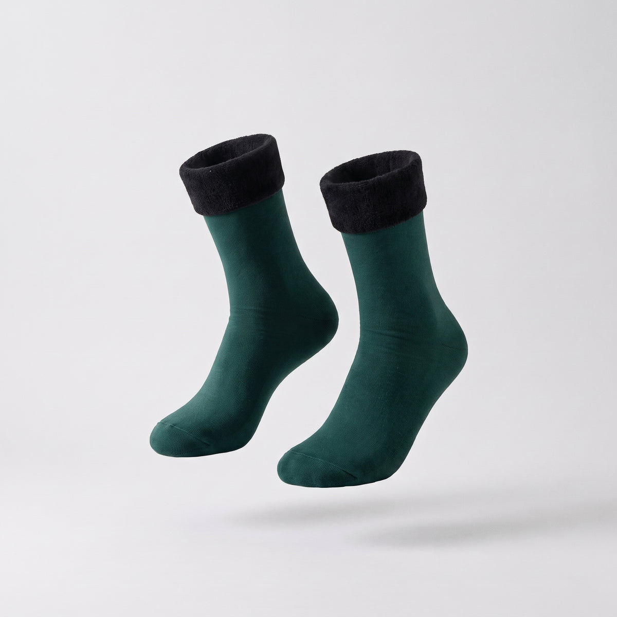Chaussettes unies vertes à revers duveteux présentées sans pied