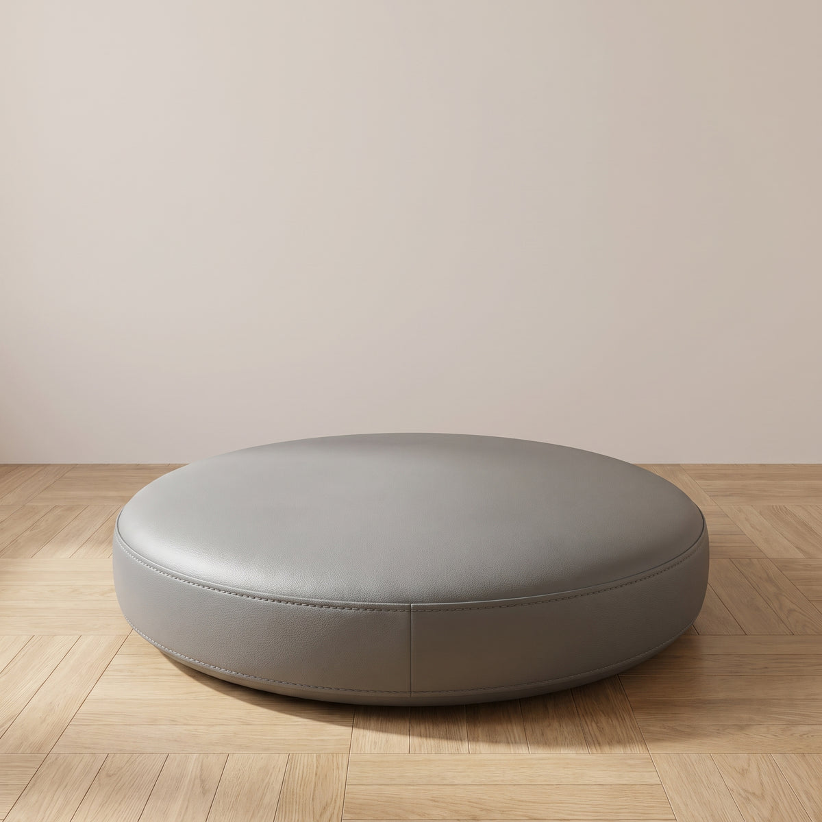 Coussin de sol rond en simili cuir gris foncé