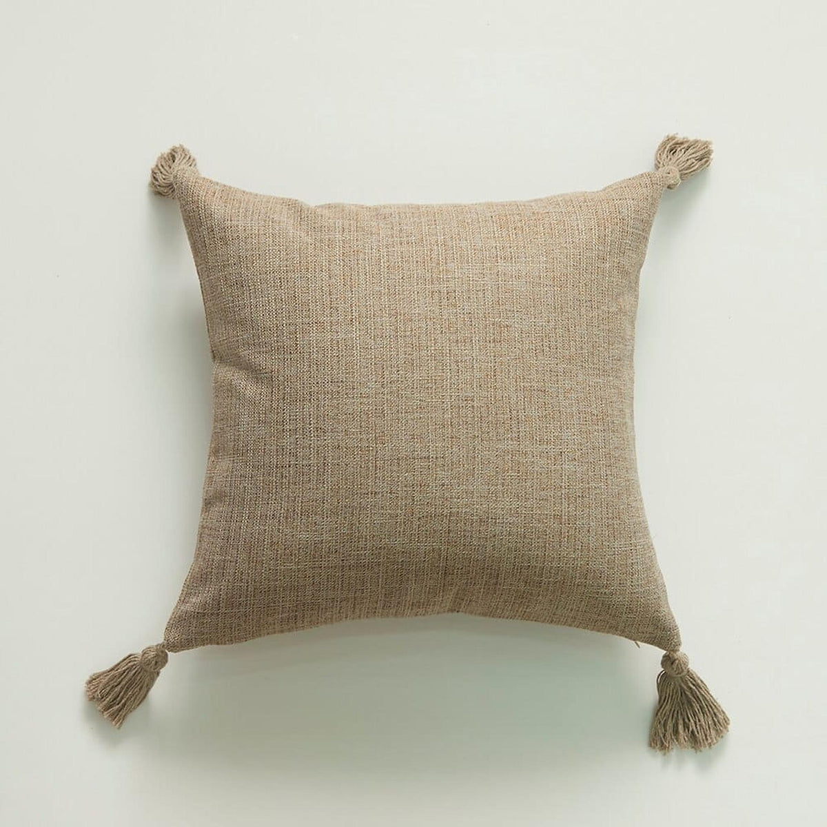 Détail du tissage chiné et du pompon de la housse de coussin Image