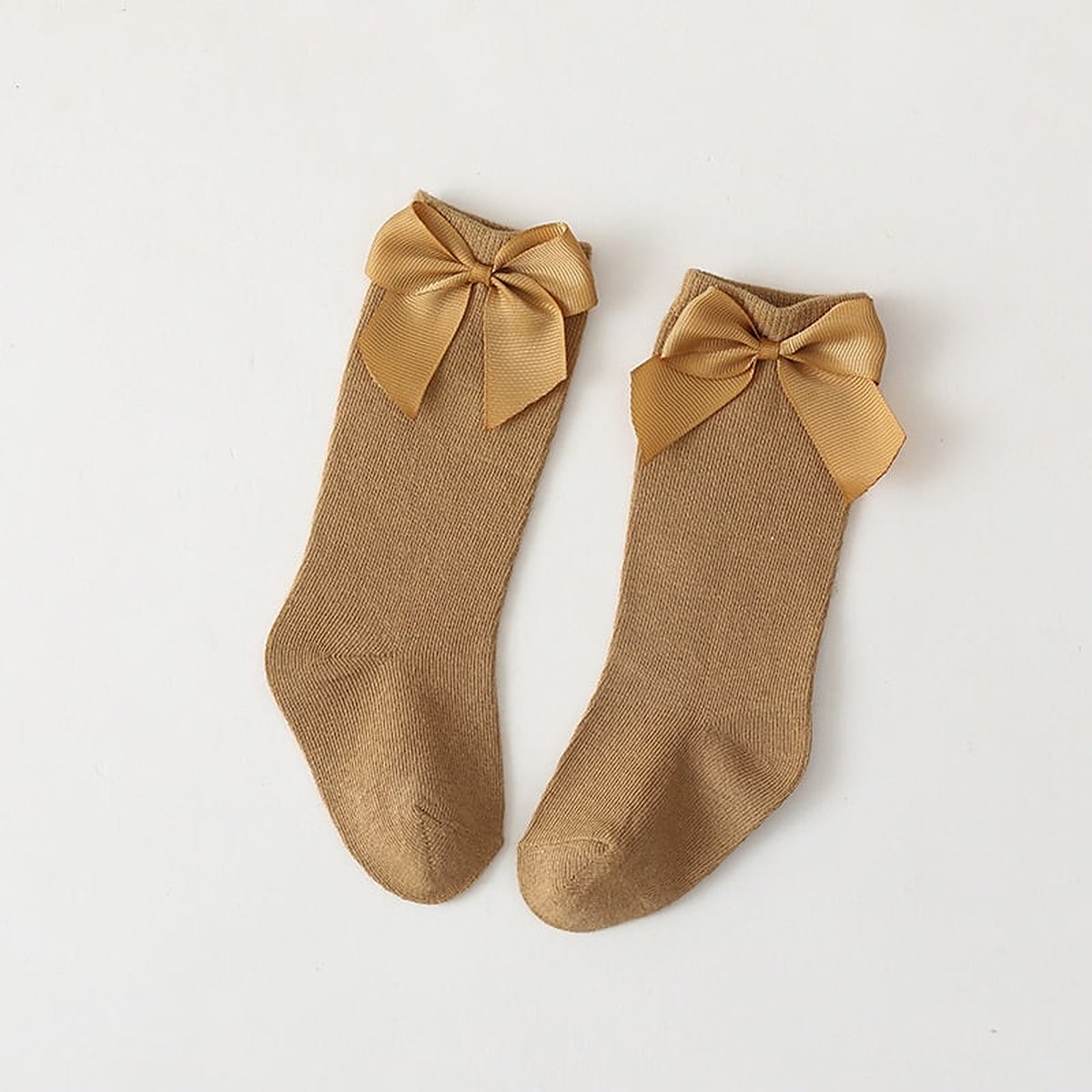 Paire de chaussettes hautes jaune moutarde a grand noeud pour enfant
