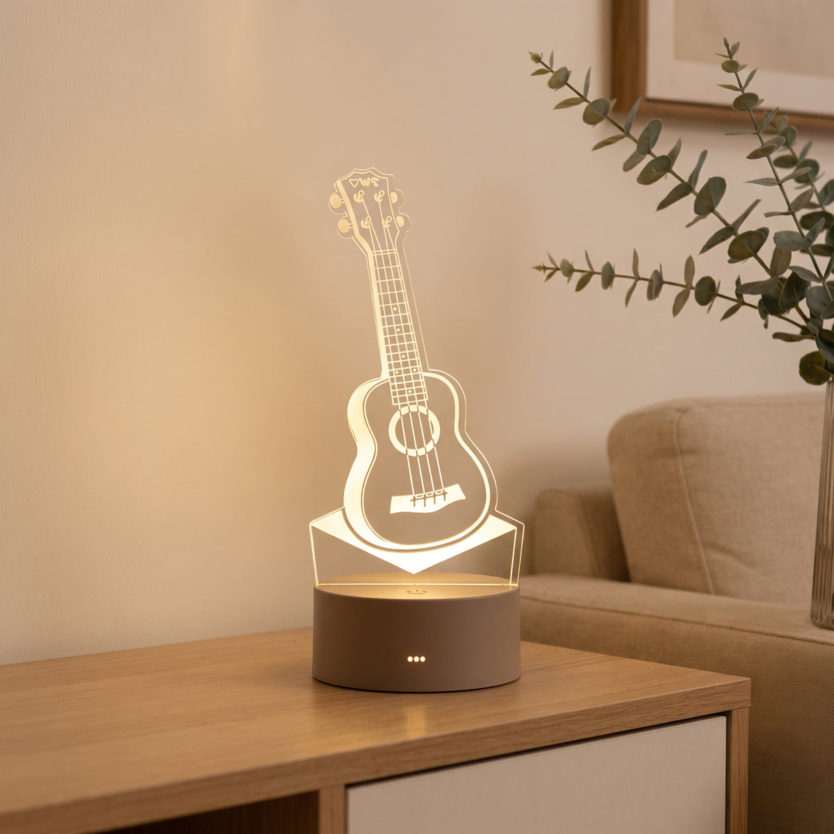 Lampe veilleuse 3D en acrylique motif guitare dans un intérieur chaleureux