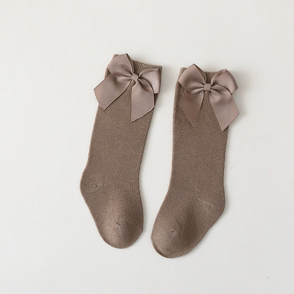 Paire de chaussettes hautes marron taupe a grand noeud pour enfant