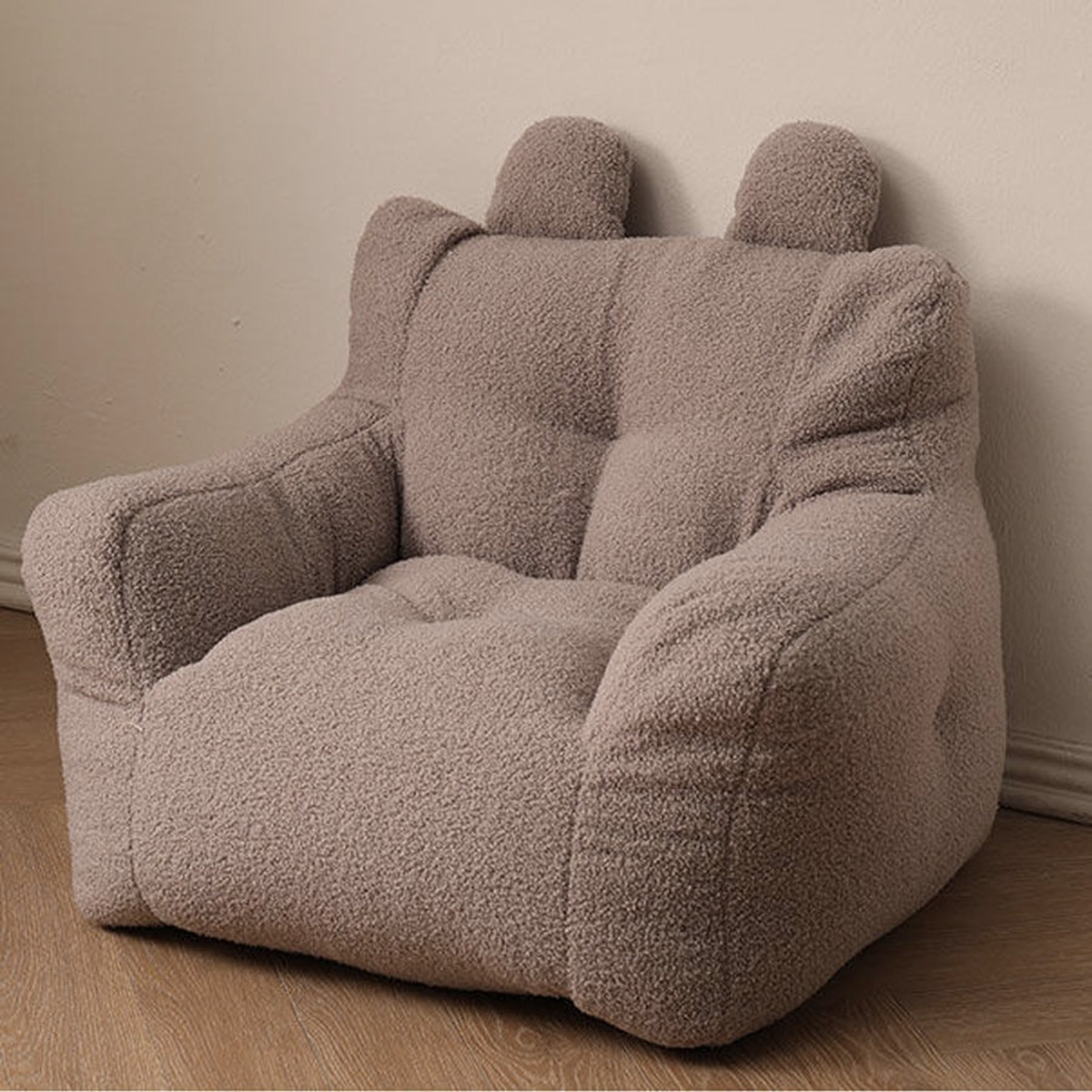 Fauteuil enfant marron en peluche avec dossier à deux oreilles et accoudoirs rembourrés