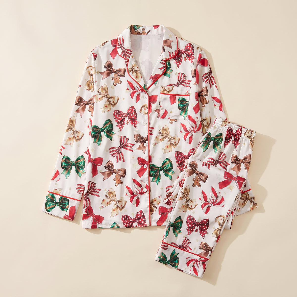 Haut et pantalon du pyjama de Noël femme à nœuds et cannes en sucre sur fond uni