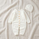 Barboteuse en tricot côtelé pour bébé avec bonnet assorti, à plat, coloris blanc