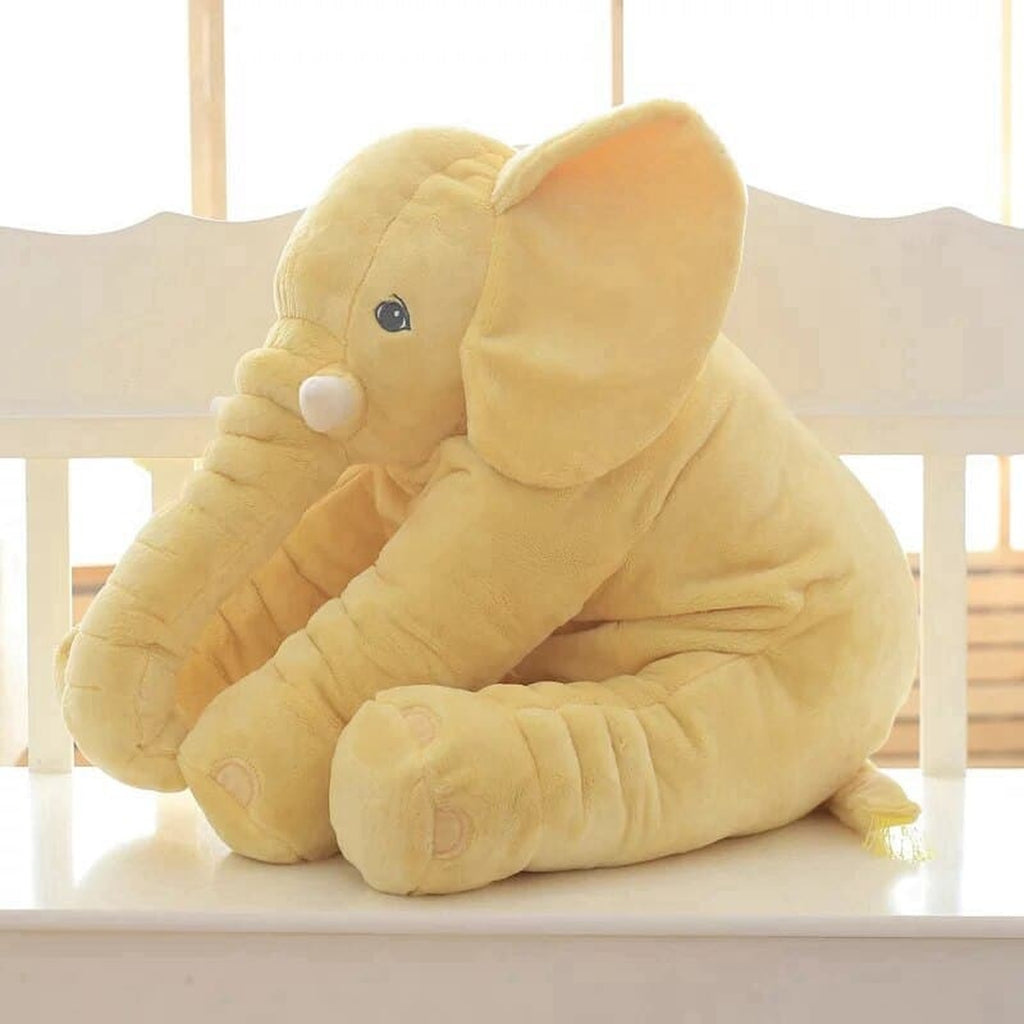 Peluche éléphant jaune assise vue de trois quarts