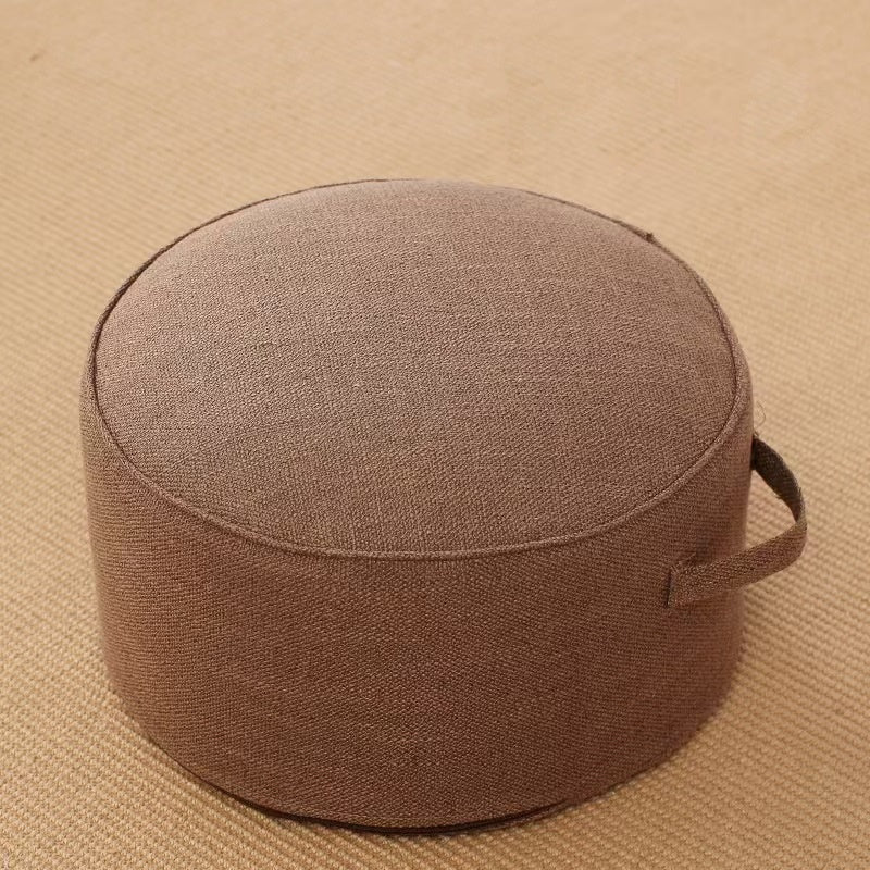 Pouf de sol rond en lin taupe, diamètre 40 cm, avec poignée et passepoil