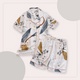 Pyjama d'été ivoire rosé à motifs de plumes et d'astres