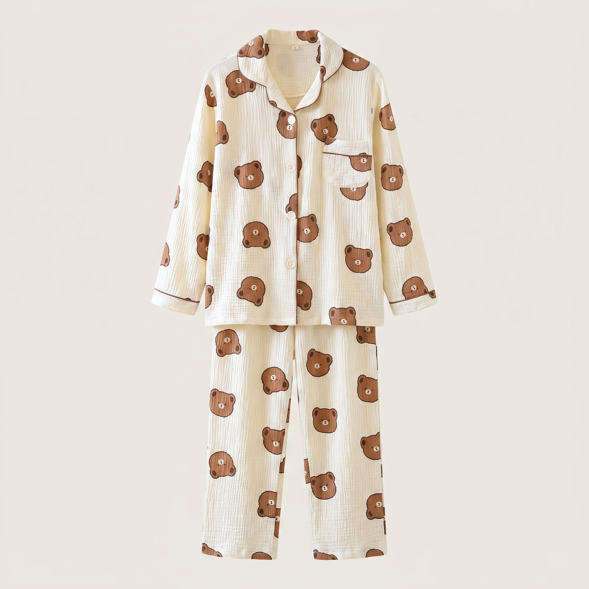 Chemise et pantalon du pyjama nounours écru présentés en volume sur fond neutre.