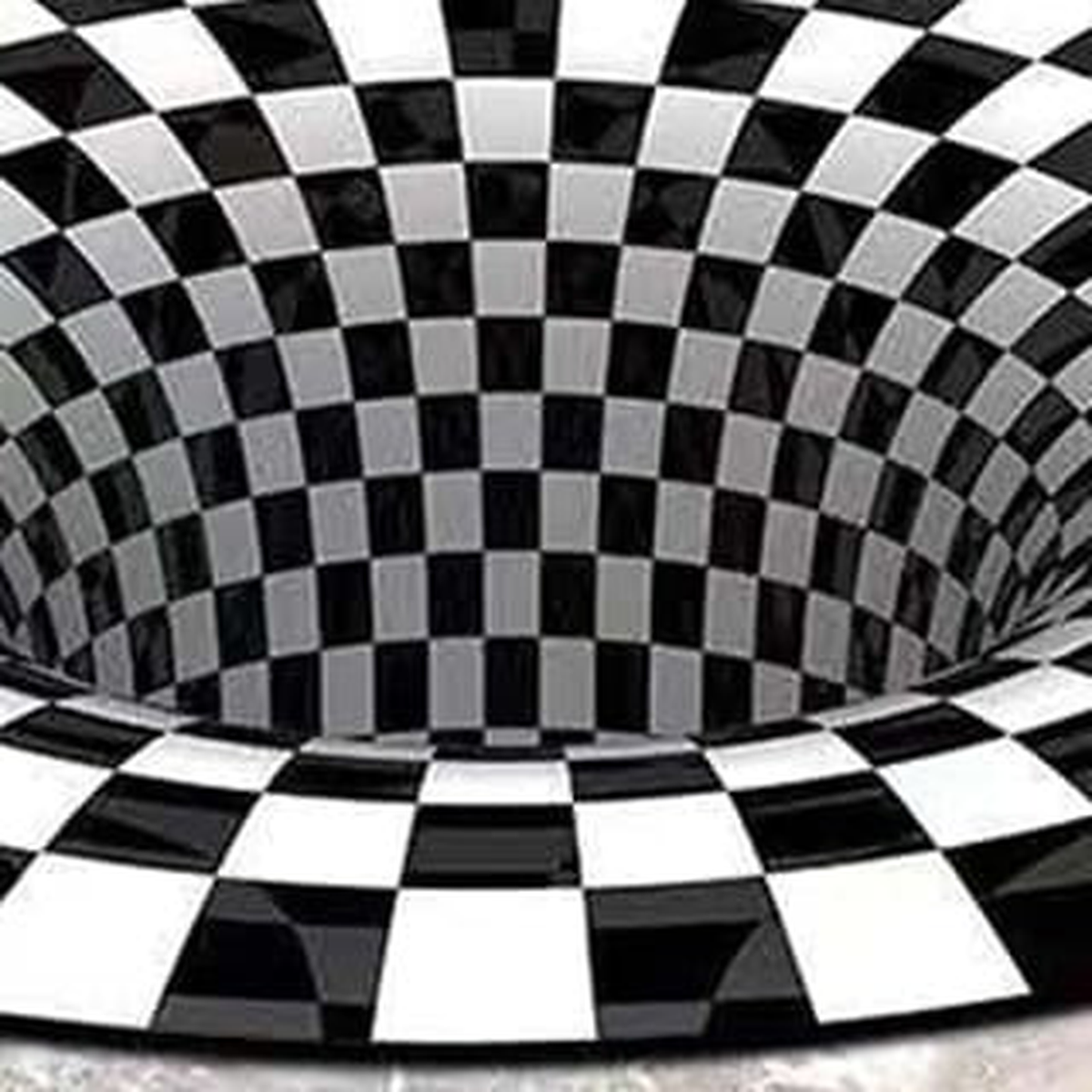 Détail du damier concentrique du tapis illusion d’optique