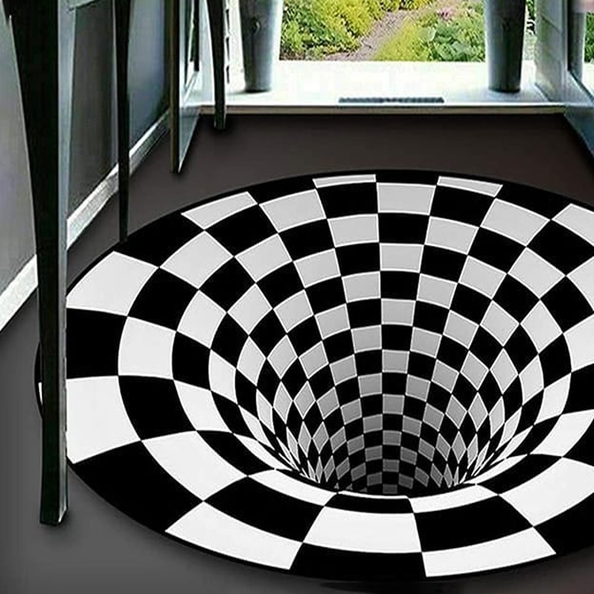 Détail du tapis illusion en damier noir et blanc