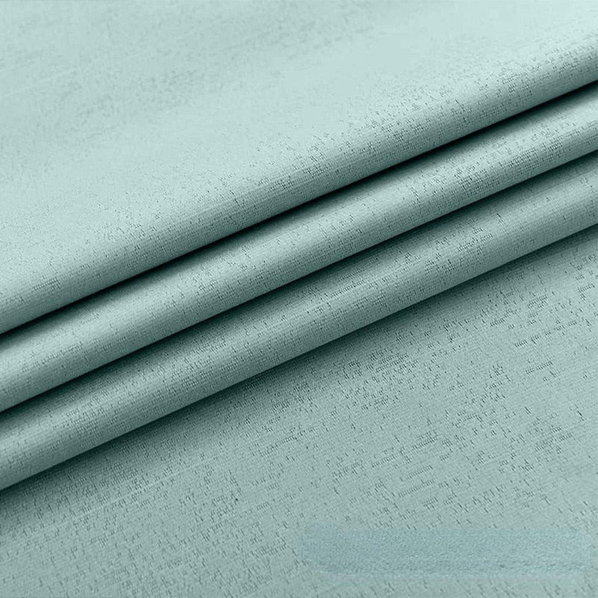 Tissu vert clair du rideau occultant anti-feu, gros plan sur les plis et le tissage