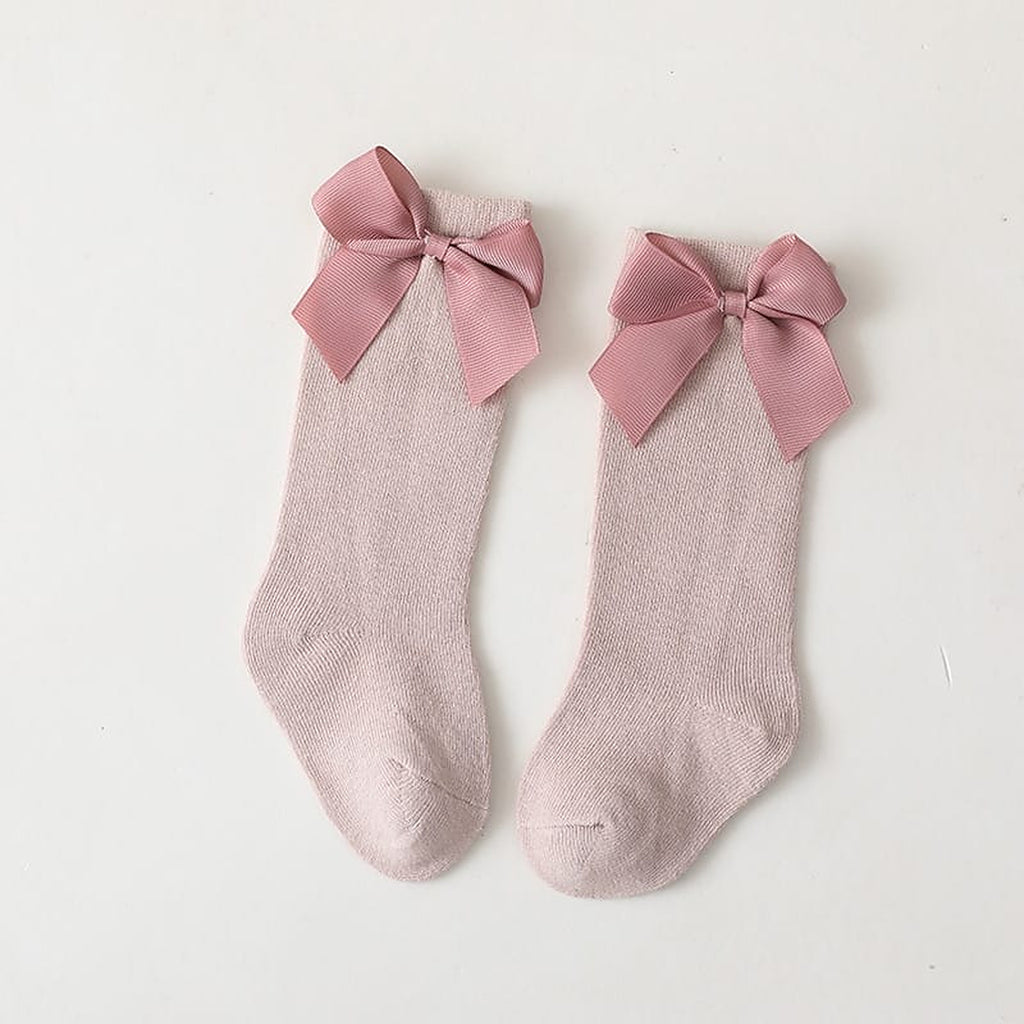Paire de chaussettes hautes roses a grand noeud pour enfant