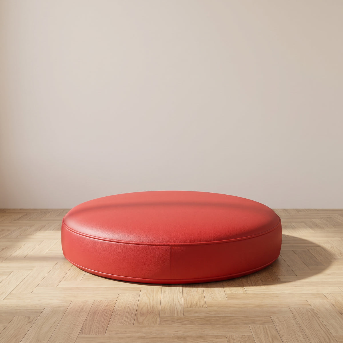 Coussin de sol rond en simili cuir rouge clair