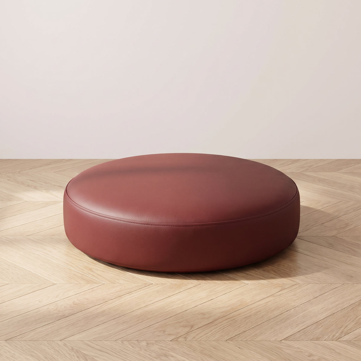 Coussin de sol rond en simili cuir rouge foncé