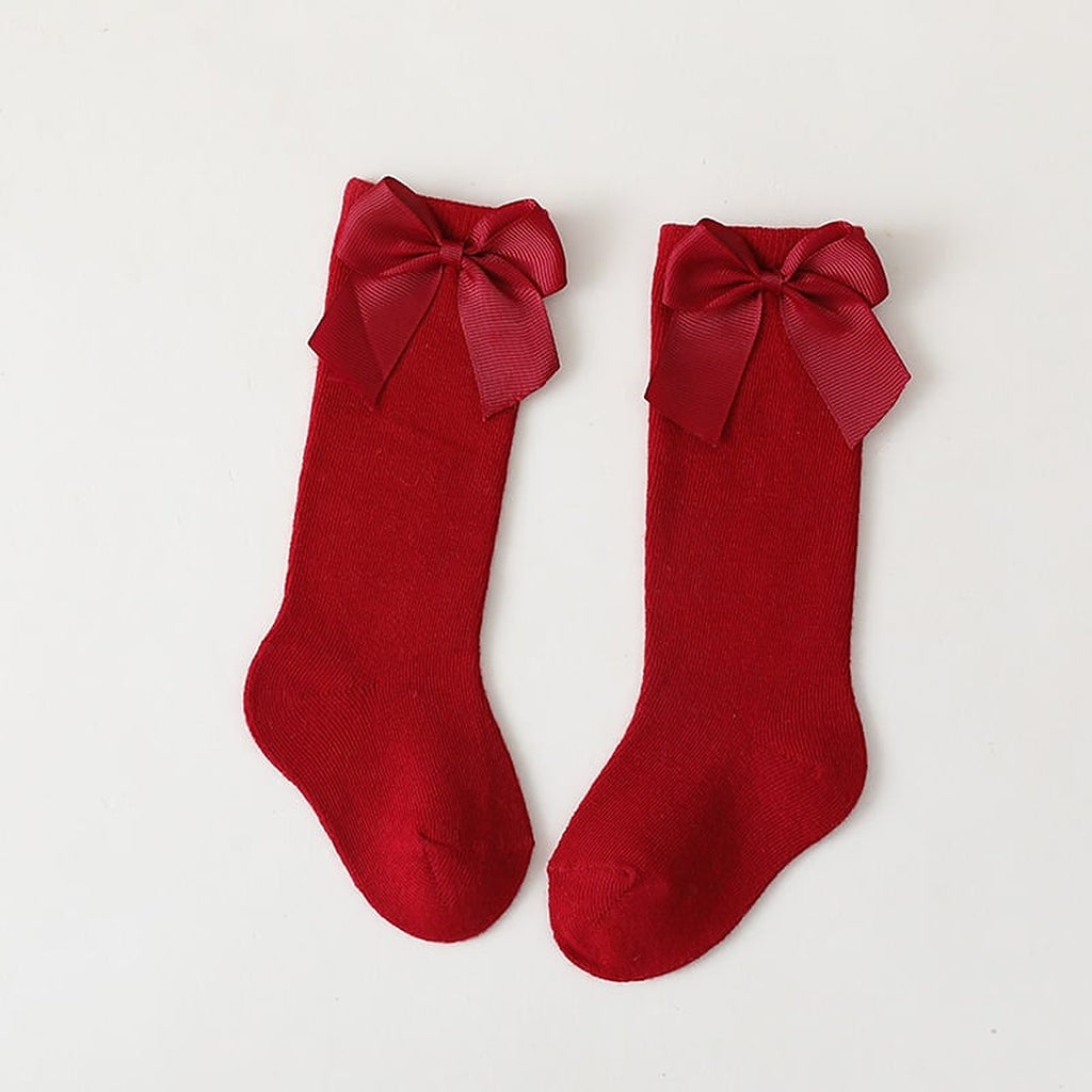 Paire de chaussettes hautes rouges a grand noeud pour enfant